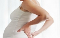 Чому болить спина (поперек) під час вагітності?
