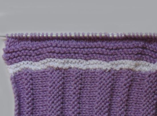 Як звязати конверт спицями для новонародженого