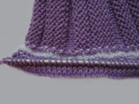 Як звязати конверт спицями для новонародженого