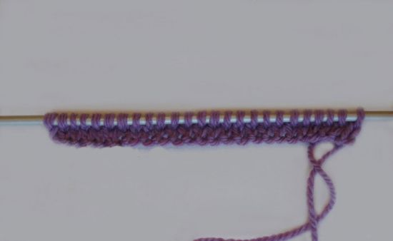 Як звязати конверт спицями для новонародженого