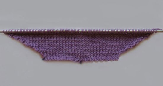 Як звязати конверт спицями для новонародженого